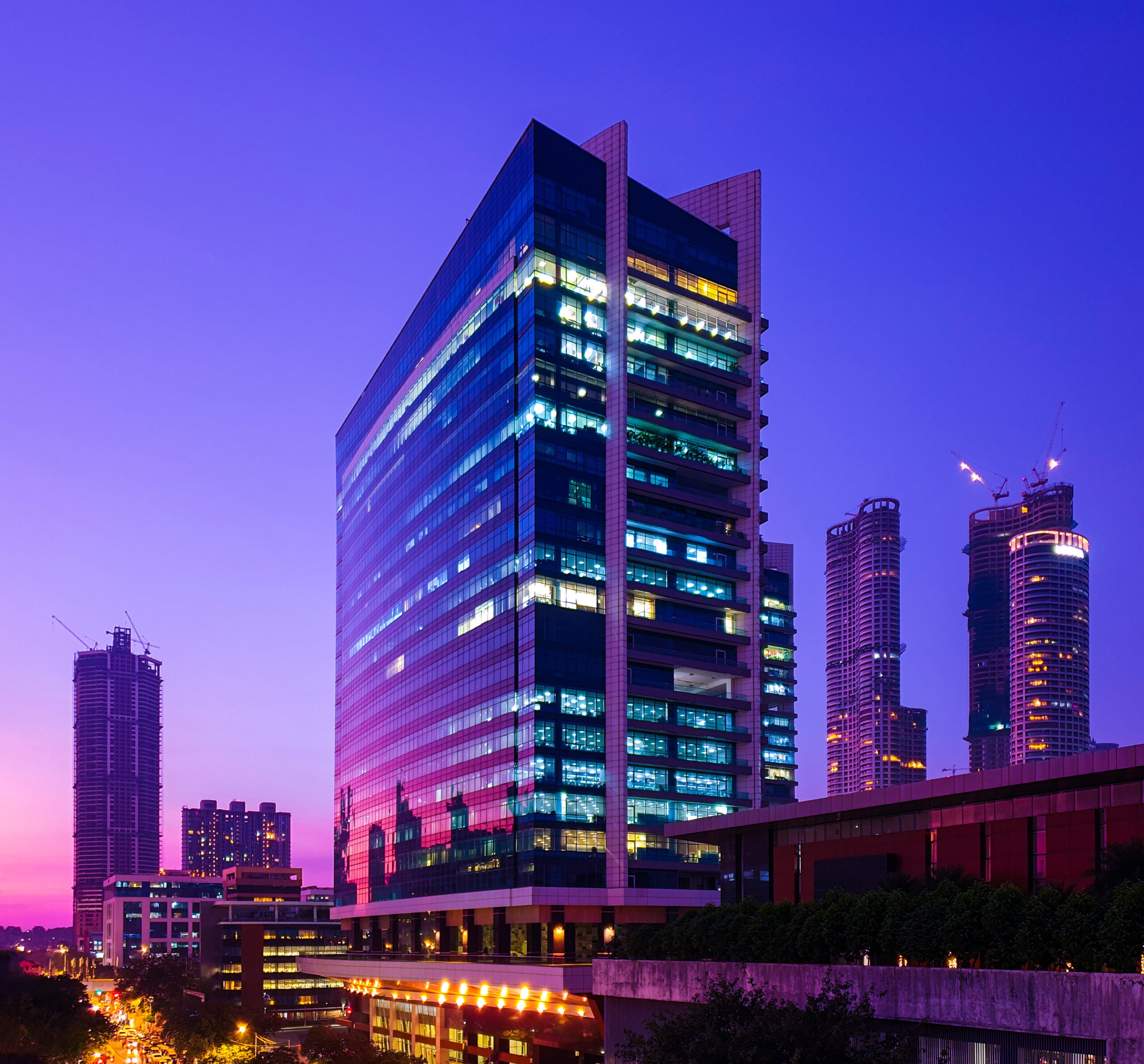 glassclad skyscrapers central mumbai reflecting sunset hues blue hour scaled
