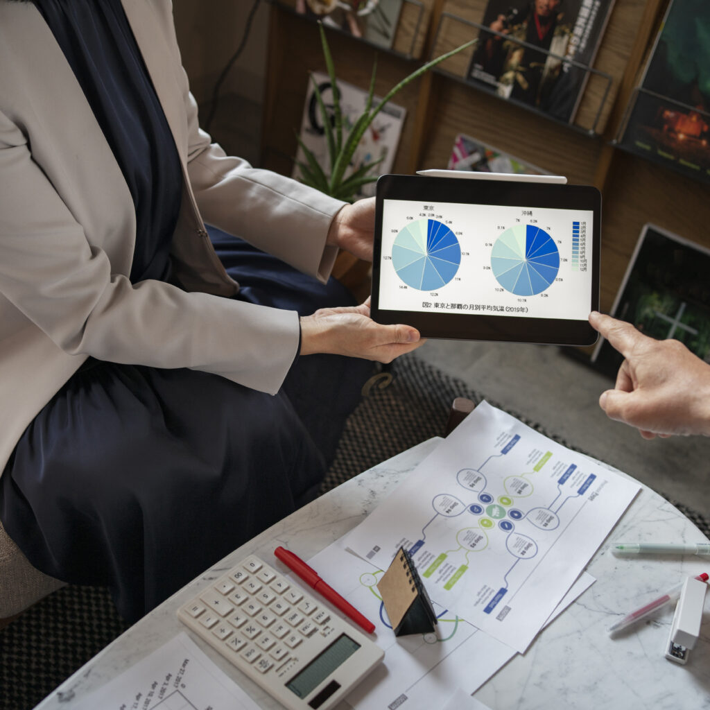 business people working with ipad high angle scaled
