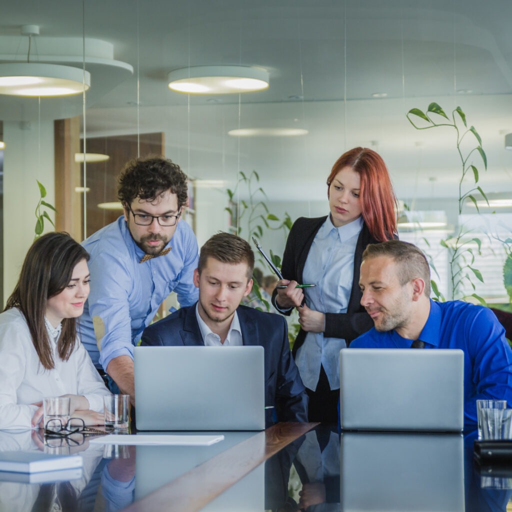 people with laptops office scaled